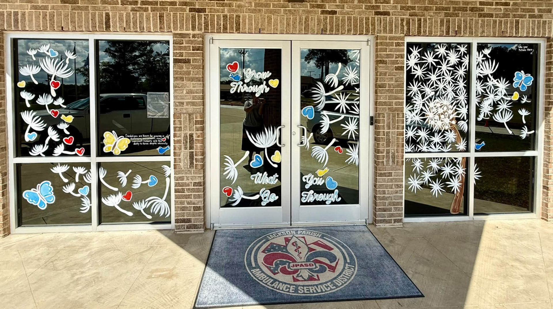 Grow Through What You Go Through — dandelion windows for Jackson Parish Ambulance Service District.